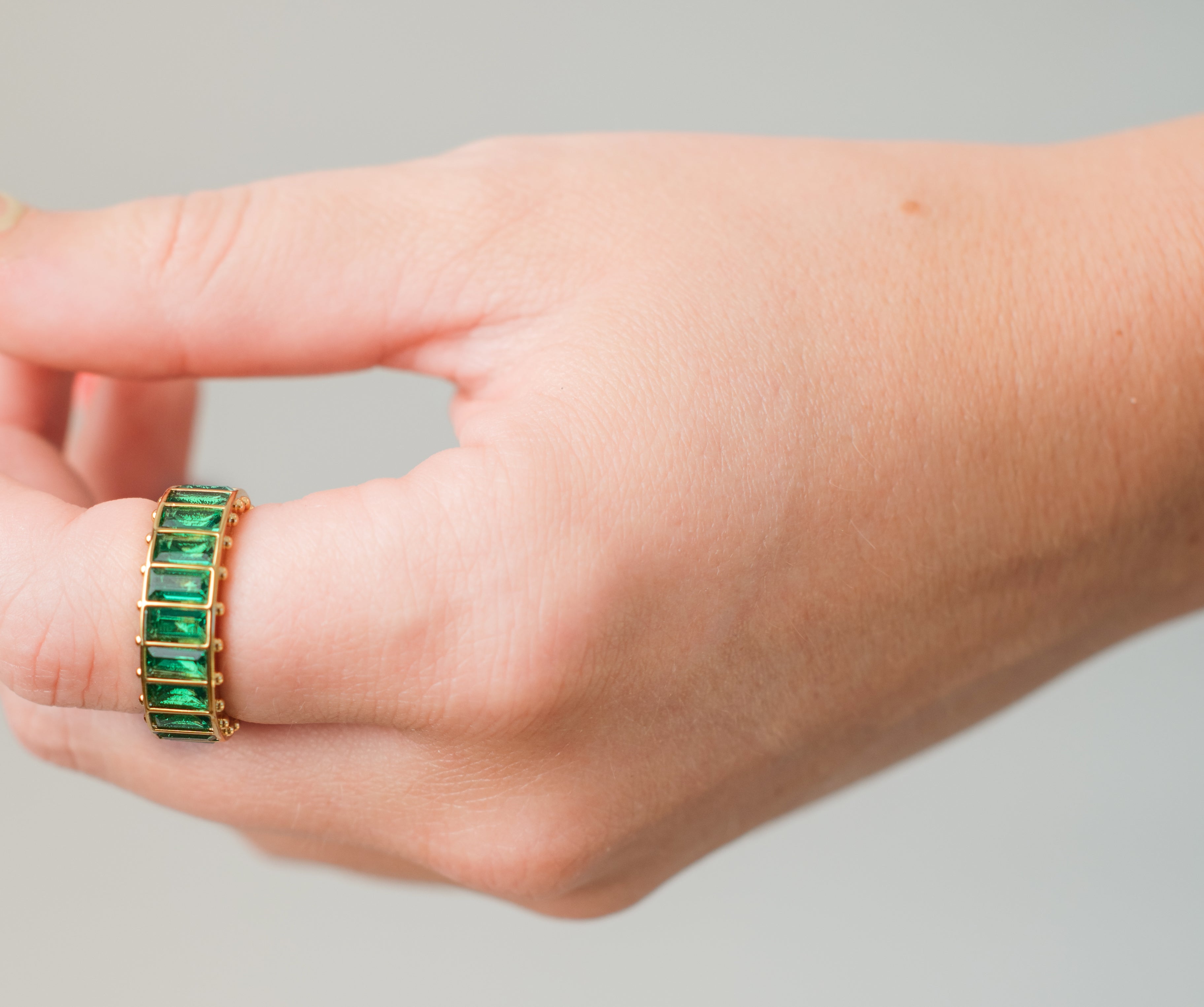Green Stone Gold Eternity Ring
